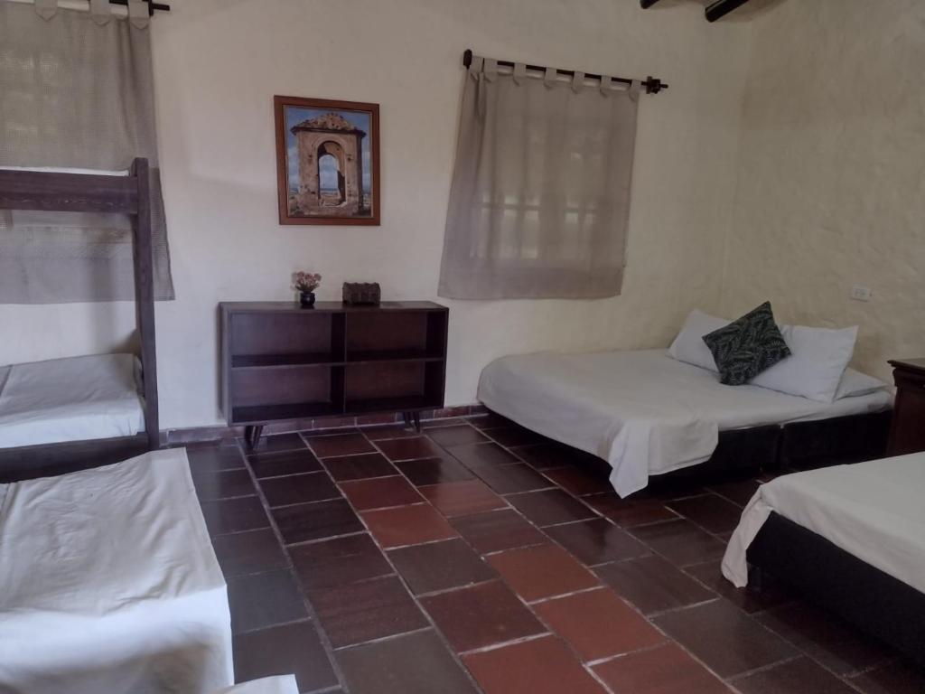 Postel nebo postele na pokoji v ubytování Villa Calusa