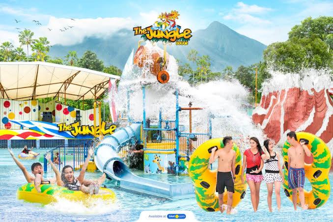 a group of people in the water at a water park at RB Room Bogorienze The Jungle Bogor in Bogor