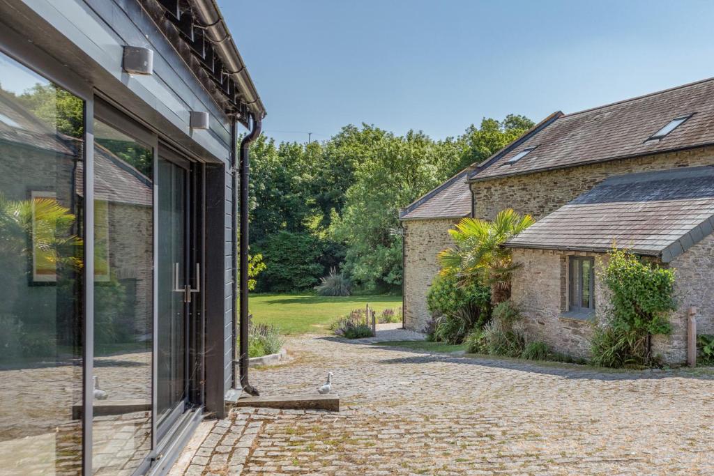 an internal view of the house and the garden at Linham Barn in Kingsbridge