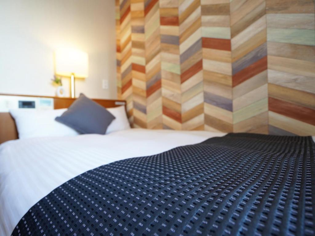 Postel nebo postele na pokoji v ubytování Hotel New Gaea Itoshima