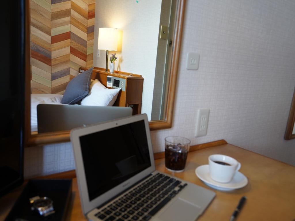 Postel nebo postele na pokoji v ubytování Hotel New Gaea Itoshima