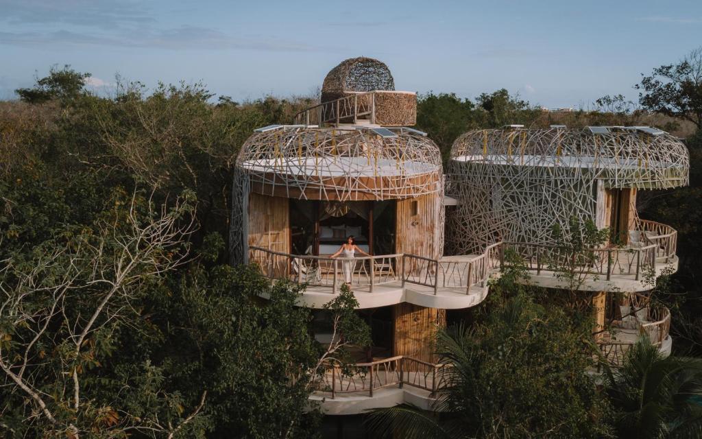 an aerial view of a building with two domes at Kan Tulum in Tulum