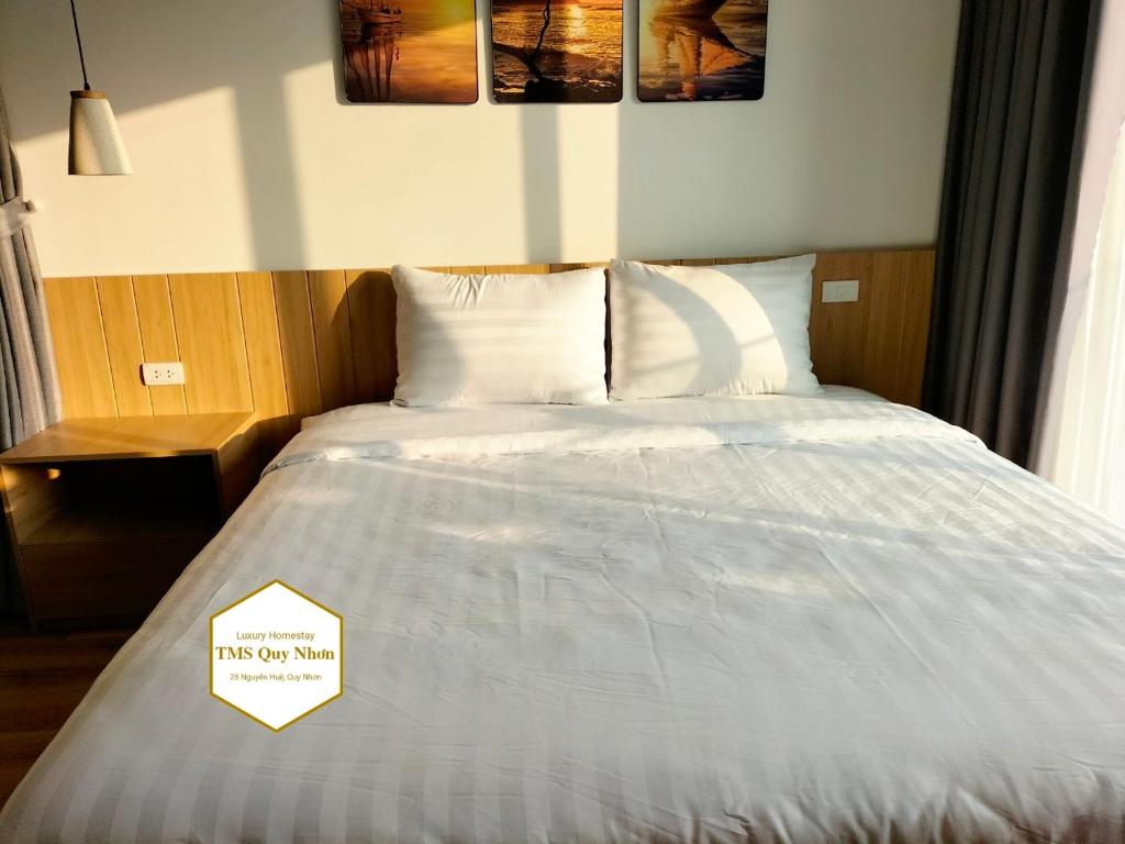 Giường trong phòng chung tại TMS Quy Nhơn Luxury Homestay