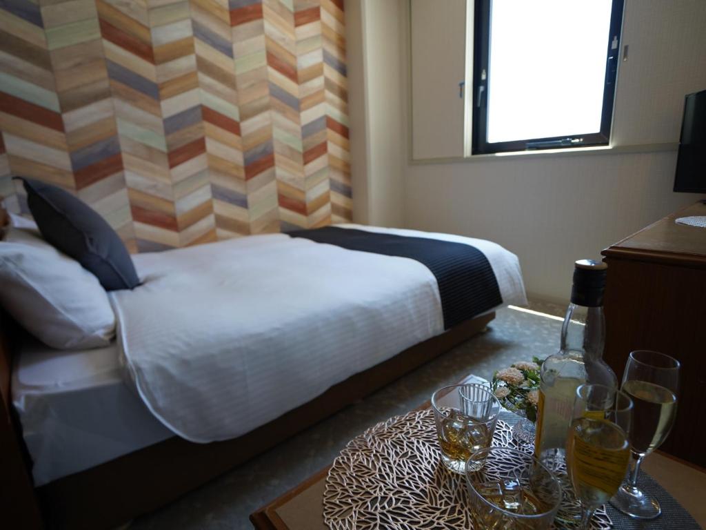 Postel nebo postele na pokoji v ubytování Hotel New Gaea Itoshima