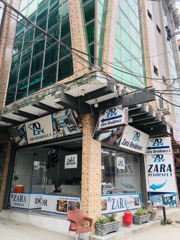 a zarmaarma restaurant on the side of a building at Zara Residence 1 in Swat