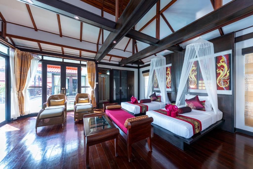 A bed or beds in a room at Phi Phi Natural Resort