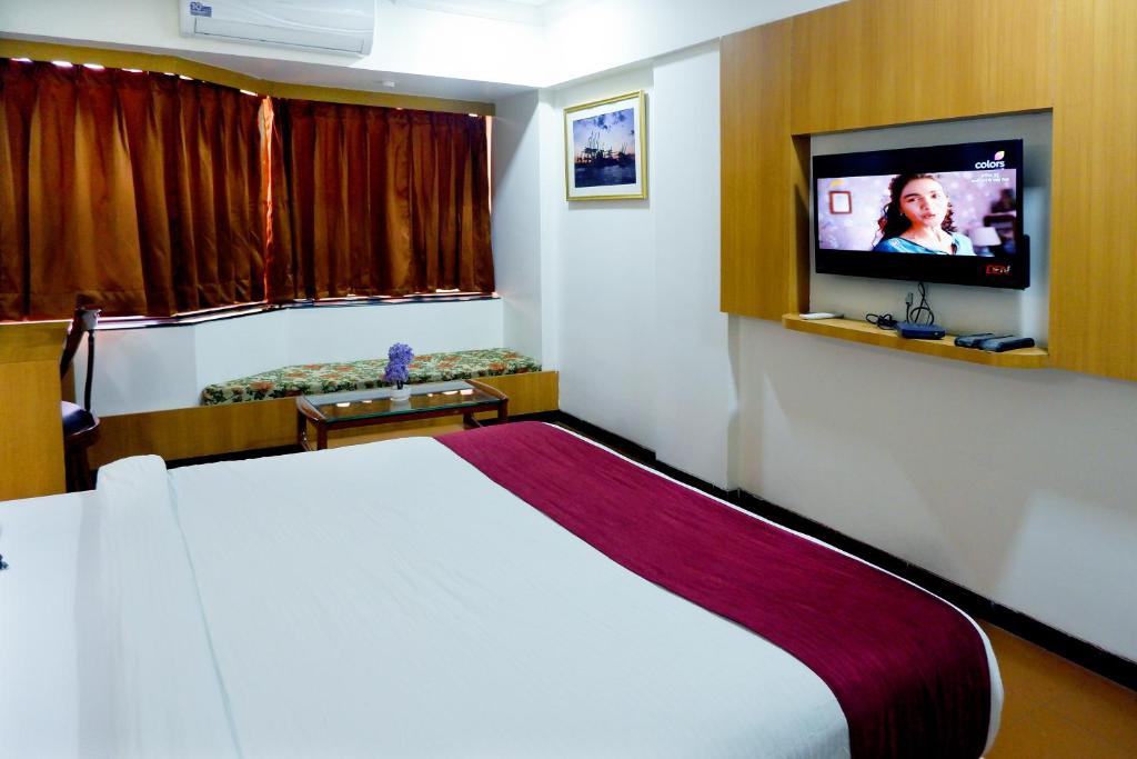 TV a/nebo společenská místnost v ubytování Hotel Kewal