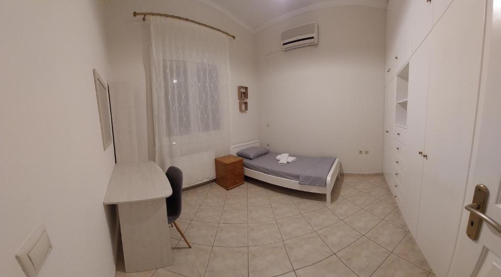 Postel nebo postele na pokoji v ubytování Kallistimon House