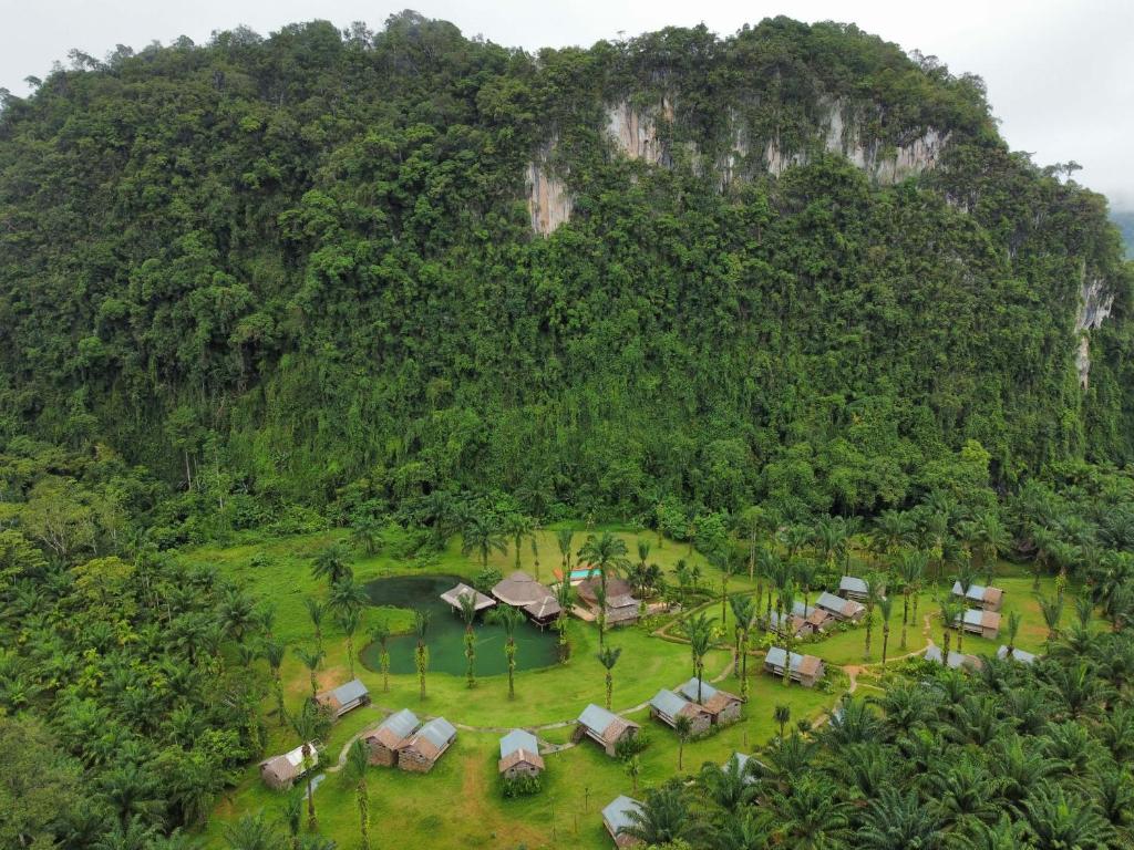 an aerial view of a resort in front of a mountain at Khaosok Boutique Hideaway - Cliff Tent in Khao Sok