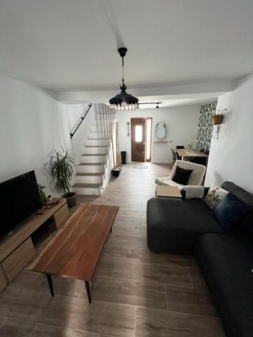 a living room with a couch and a tv at La Casa de la Abuela in Mijas