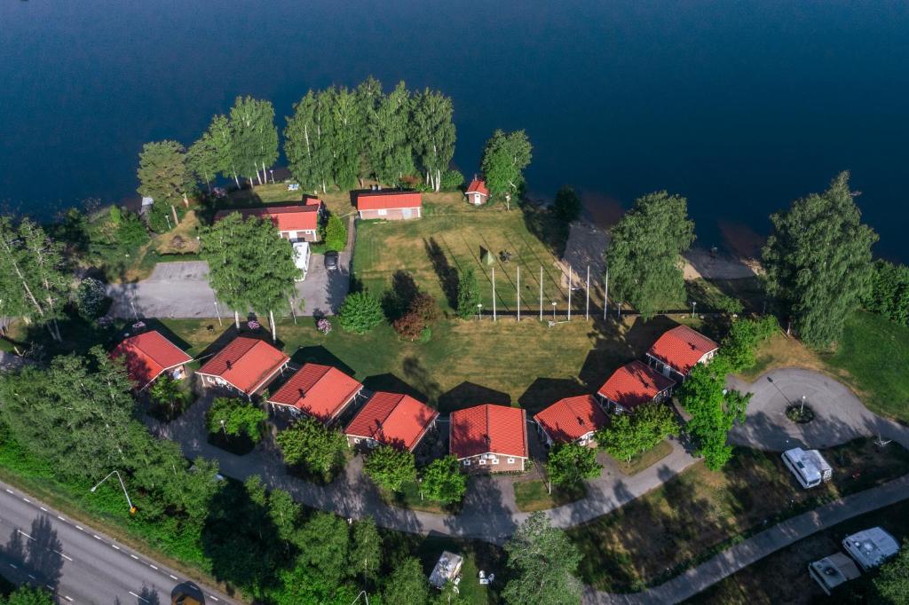 an aerial view of a house on an island in the water at Hindås Lake Camp in Hindås