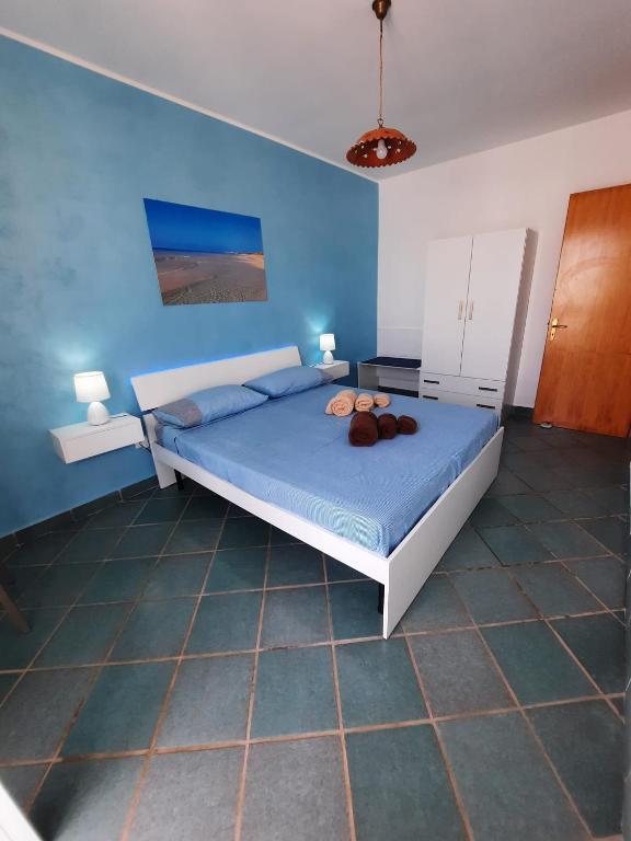 Łóżko lub łóżka w pokoju w obiekcie Fronte Mare