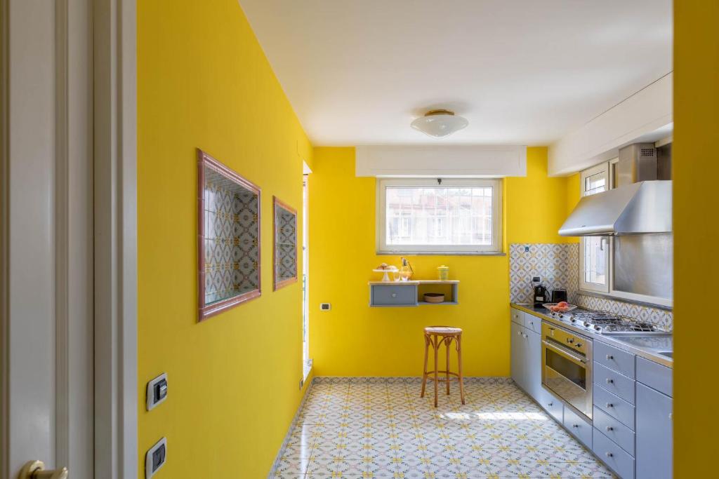 A kitchen or kitchenette at iFlat Margutta Colors on Canvas Apartment