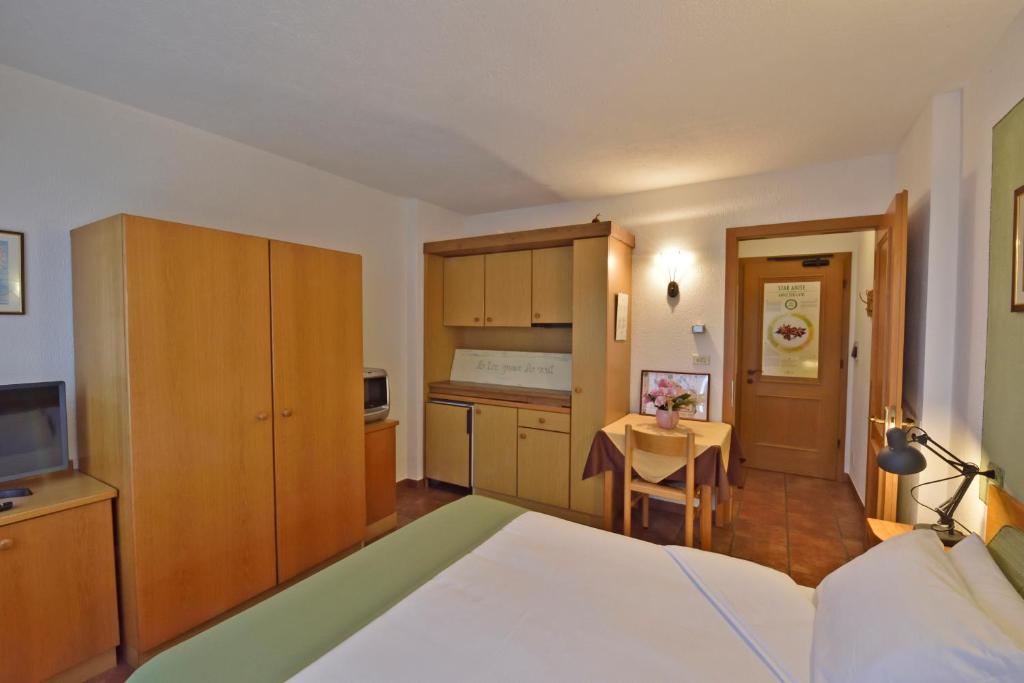 Postel nebo postele na pokoji v ubytování La Roche Hotel Appartments