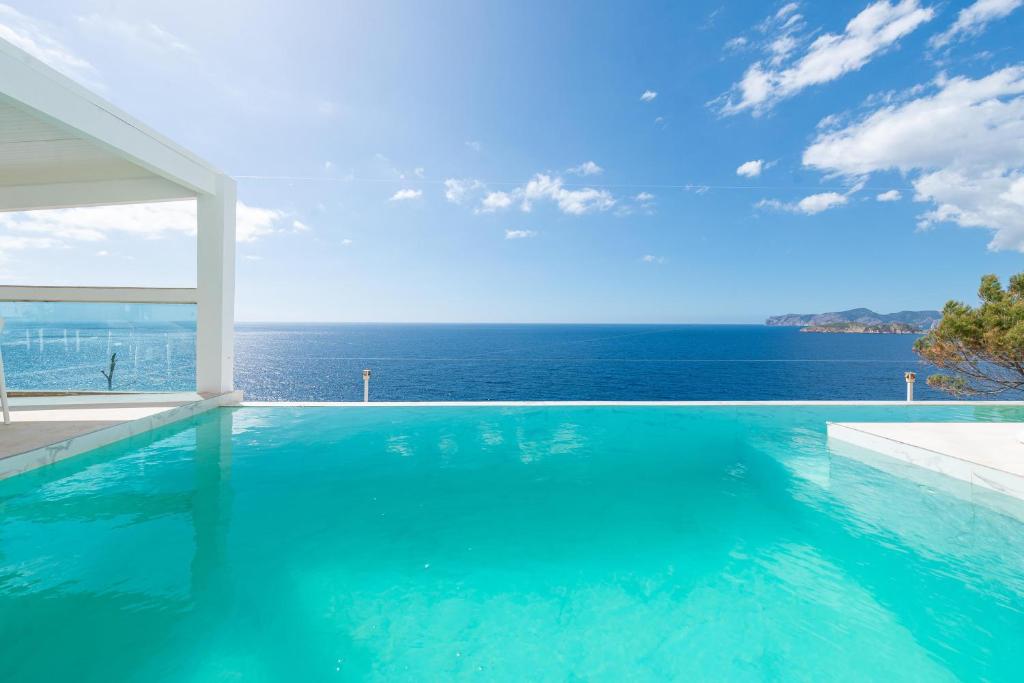 a swimming pool with a view of the ocean at Son Fibla in El Toro