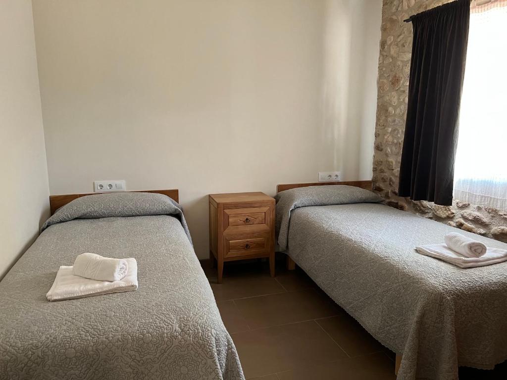 Postel nebo postele na pokoji v ubytování Can Clotas Hotel Masia