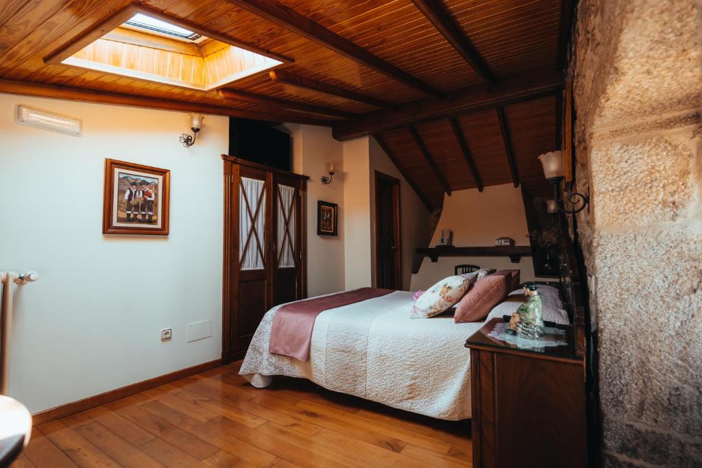 Postel nebo postele na pokoji v ubytování Os Migueliños