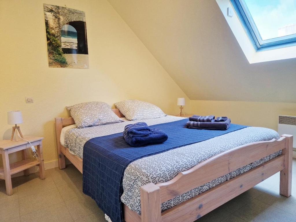 Postel nebo postele na pokoji v ubytování Les Maisons de Kerdavid'île - votre résidence de vacances à Belle ile en mer