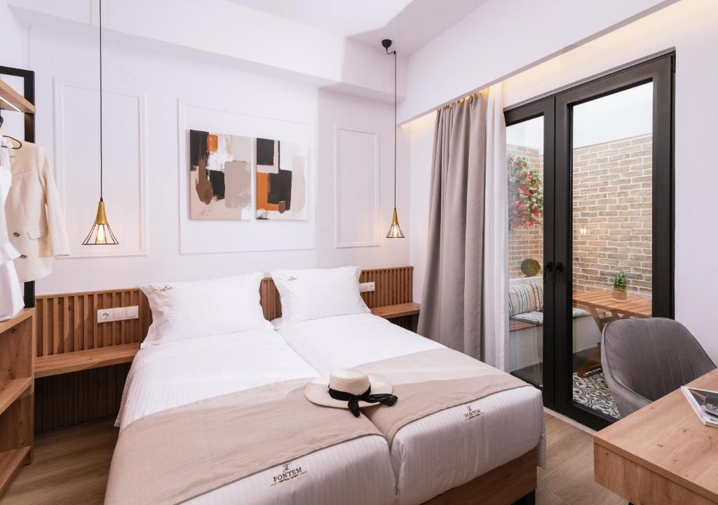 Postel nebo postele na pokoji v ubytování Fontem Central Living