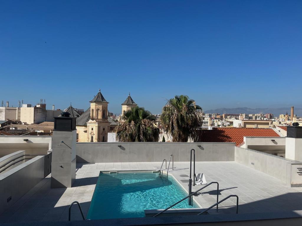 Bazén v ubytovaní Holidays2Malaga Alta Downtown Pool Paddle and Parking New building alebo v jeho blízkosti