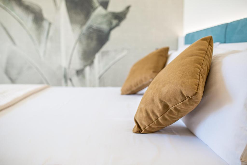 Postel nebo postele na pokoji v ubytování Hotel Jasminum