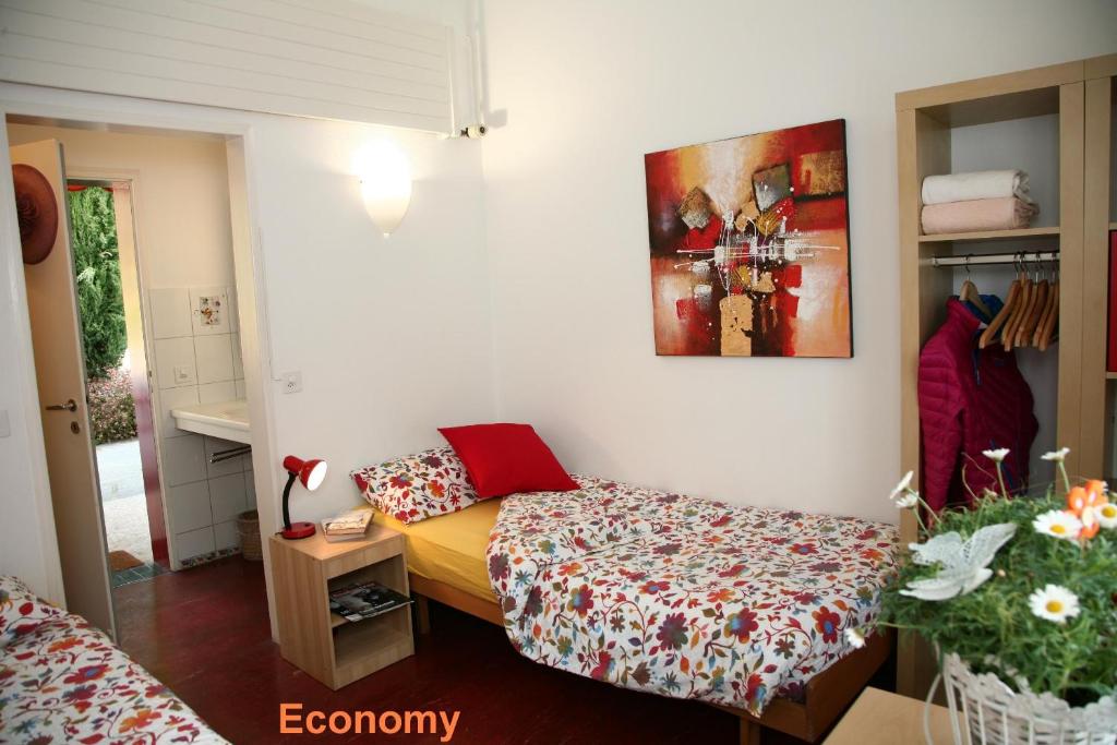 Postel nebo postele na pokoji v ubytování Lugano Savosa Youth Hostel