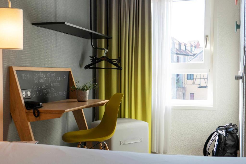 Postel nebo postele na pokoji v ubytování ibis Colmar Centre
