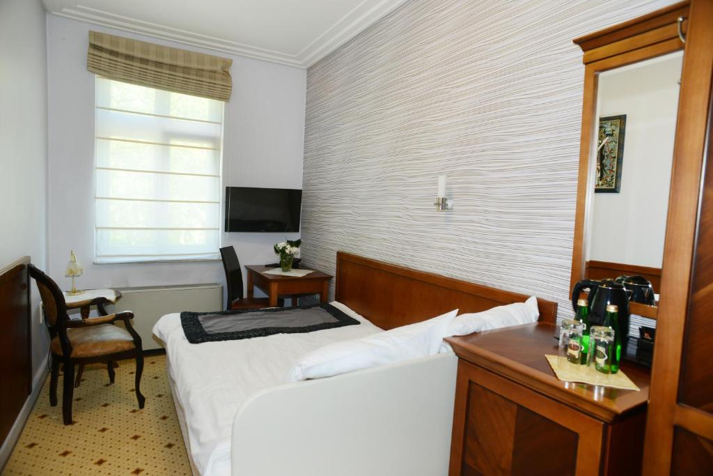 TV a/nebo společenská místnost v ubytování Hotel Apollo