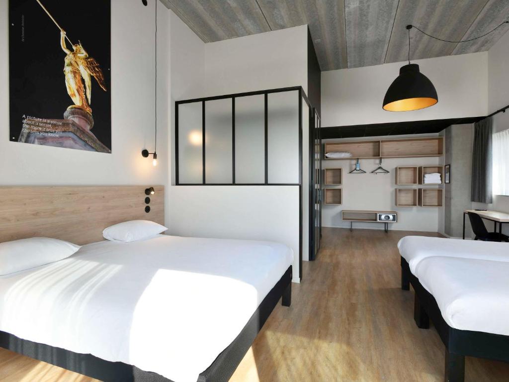 Postel nebo postele na pokoji v ubytování ibis Styles Namur