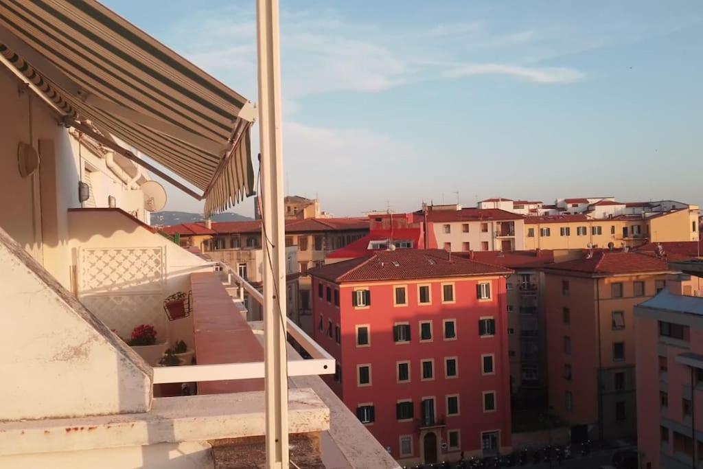 a view of a city from the balcony of a building at Angels Home in Livorno