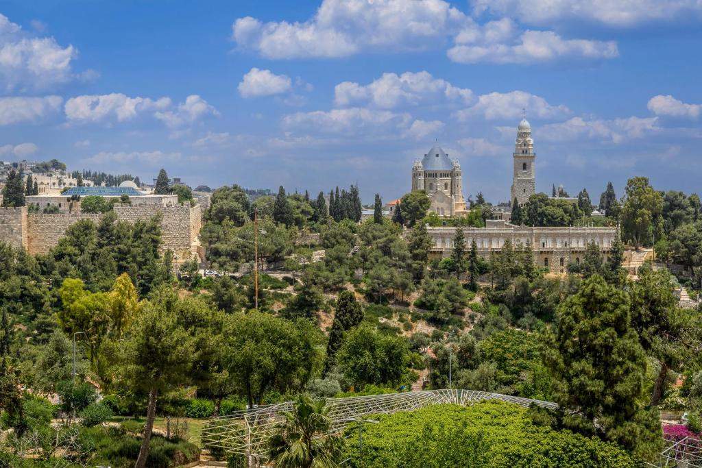 a view of the city of jerusalem with trees and buildings at Full Option 3BR next King David in Jerusalem