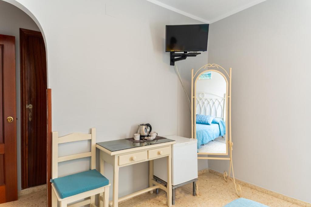 TV a/nebo společenská místnost v ubytování Hostal Miramar