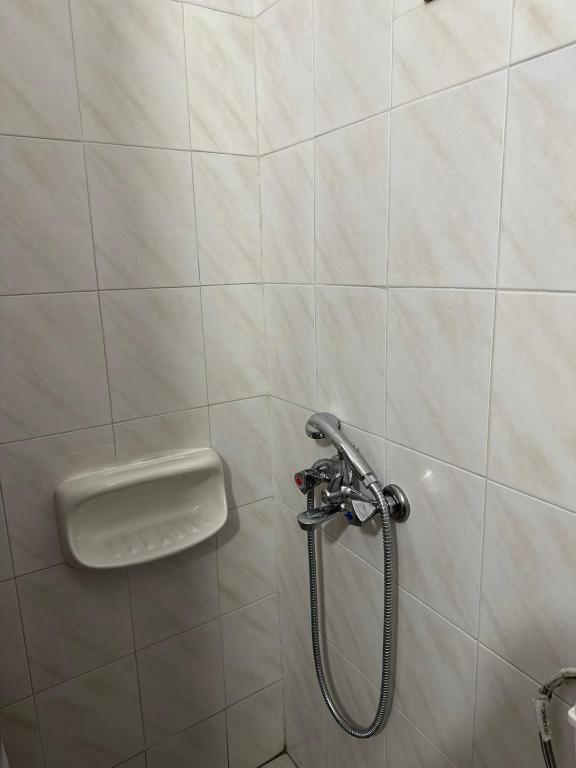 Koupelna v ubytování Κοχύλι