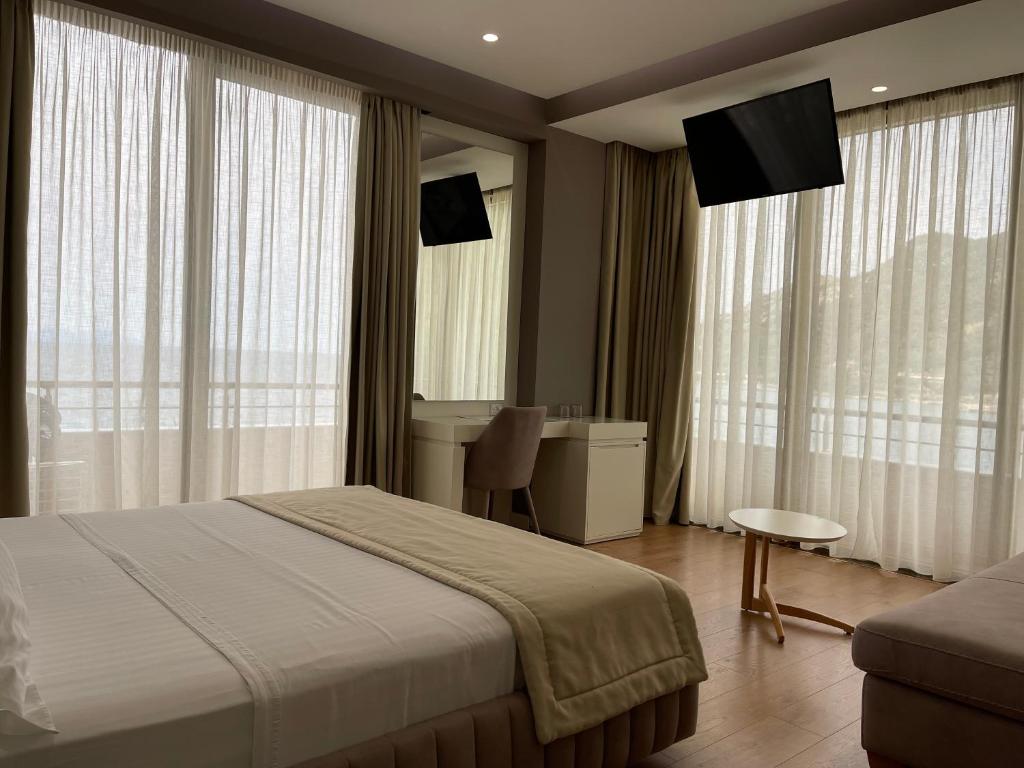 Postel nebo postele na pokoji v ubytování Paradise Beach Hotel