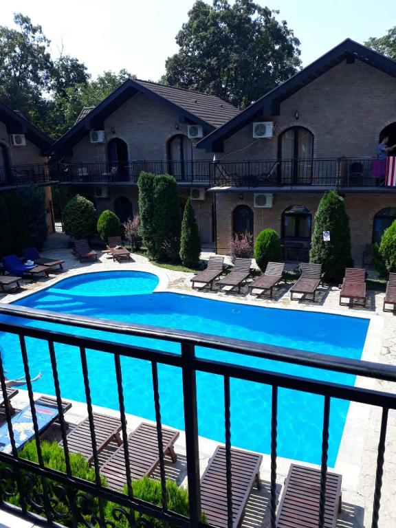 a view of a swimming pool from a balcony at Apartman Aleksa in Bela Crkva