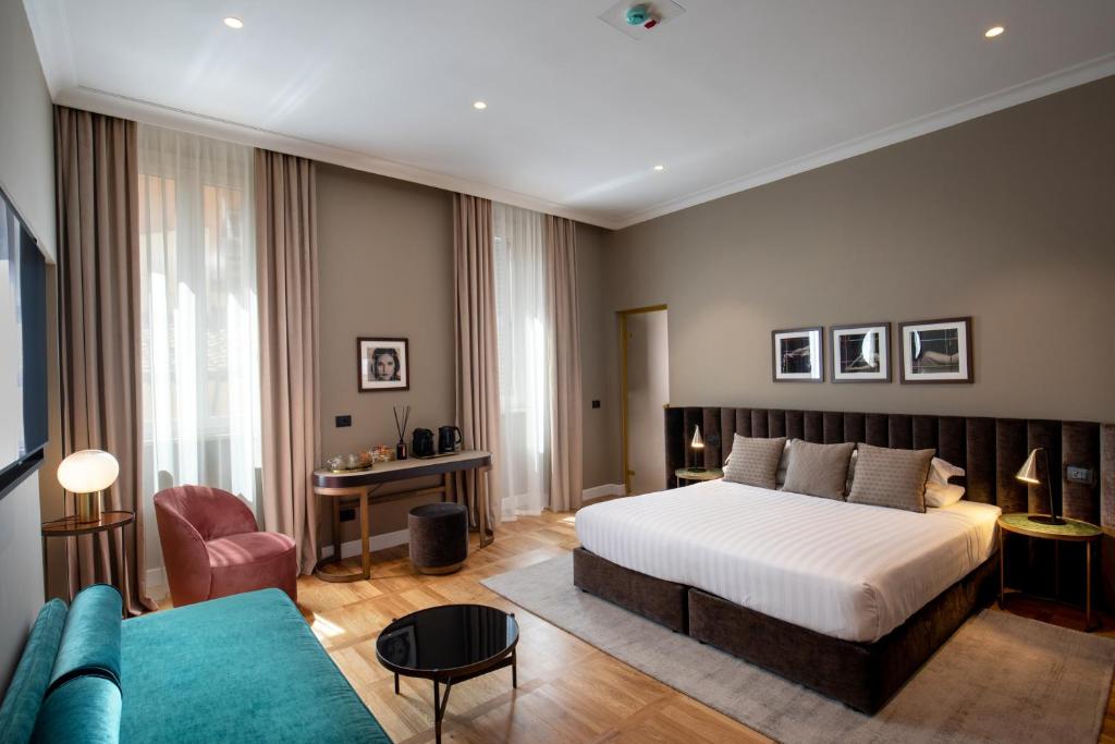 Postel nebo postele na pokoji v ubytování Condotti Boutique Hotel