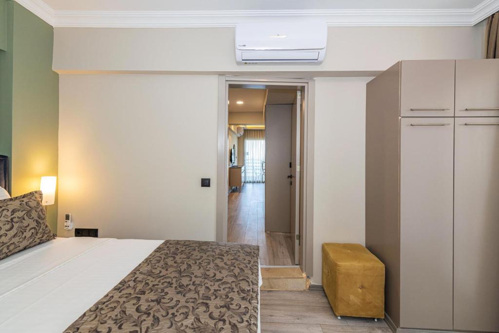 Postel nebo postele na pokoji v ubytování IDEE SUİTES Fethiye