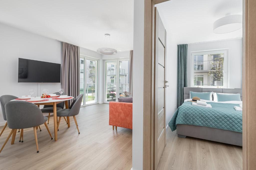 Posteľ alebo postele v izbe v ubytovaní Seaside Apartamenty Porta Mare I Kołobrzeg