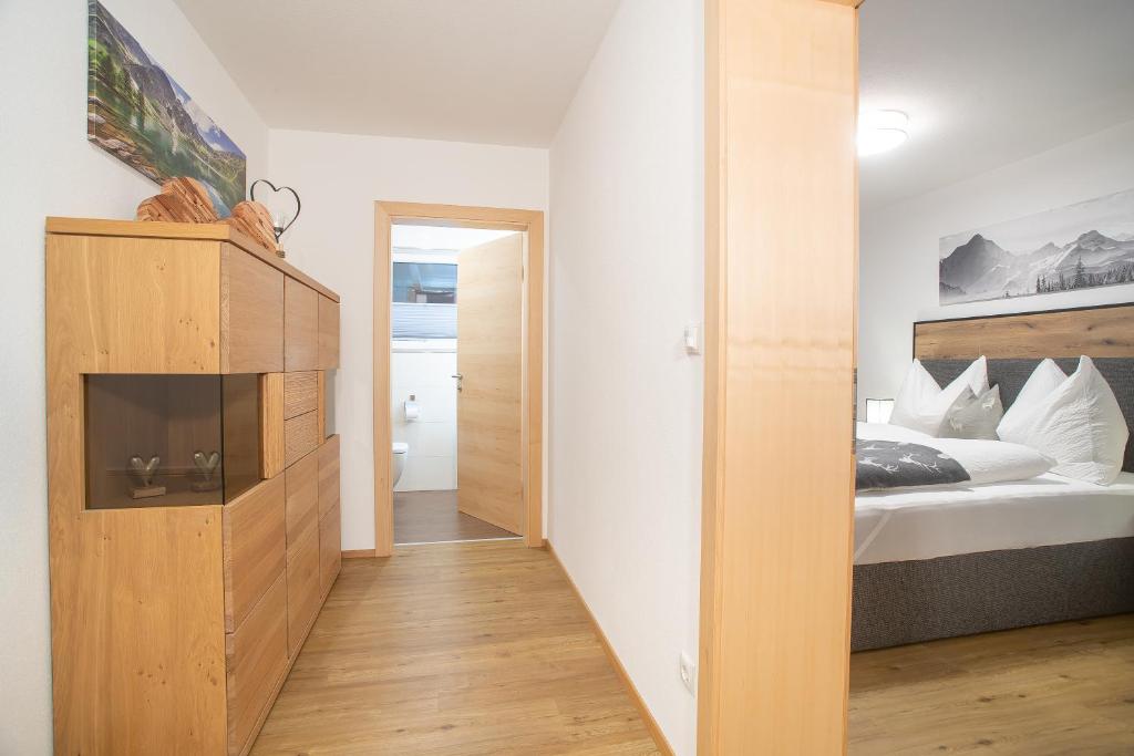 Posteľ alebo postele v izbe v ubytovaní Apart Dahoam