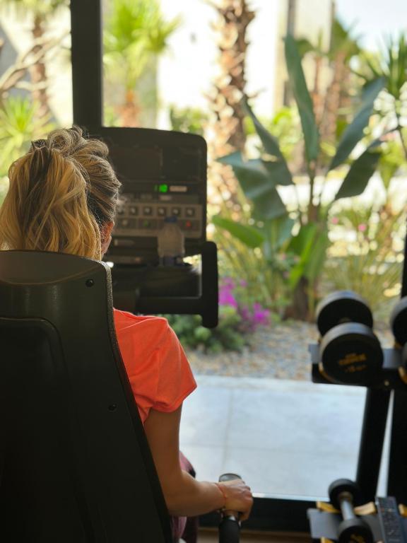 a woman sitting in a chair in front of a camera at Rammos Managed By Dedeman in Bodrum City