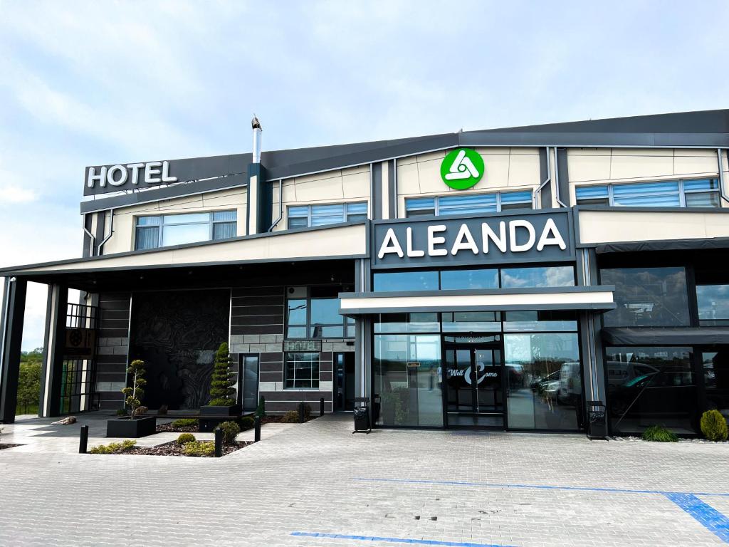 a hotel with a sign on the front of it at Aleanda in Chernivtsi