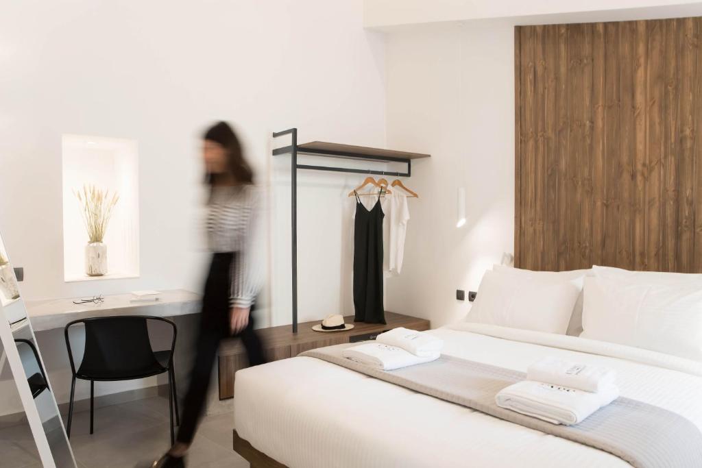 Postel nebo postele na pokoji v ubytování Evge Experience Boutique Hotel