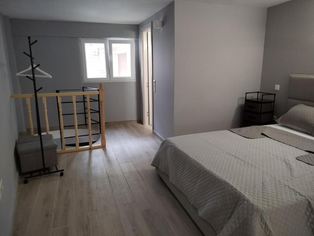 Postel nebo postele na pokoji v ubytování KingsWay Mezzanine