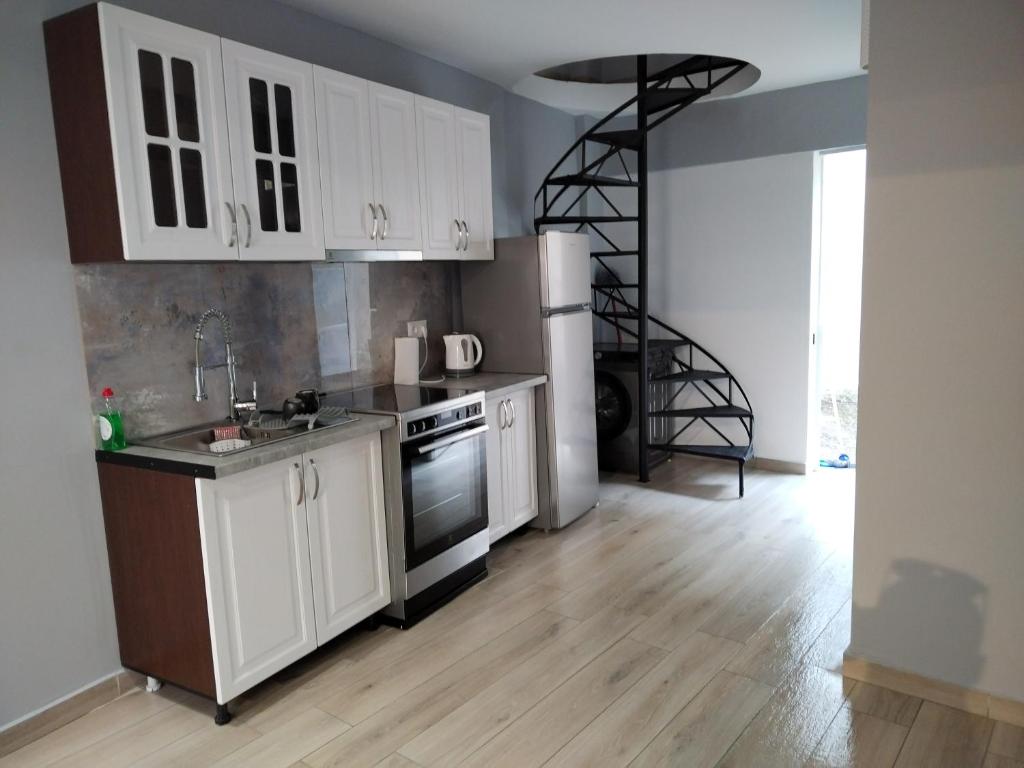 Kuchyň nebo kuchyňský kout v ubytování KingsWay Mezzanine