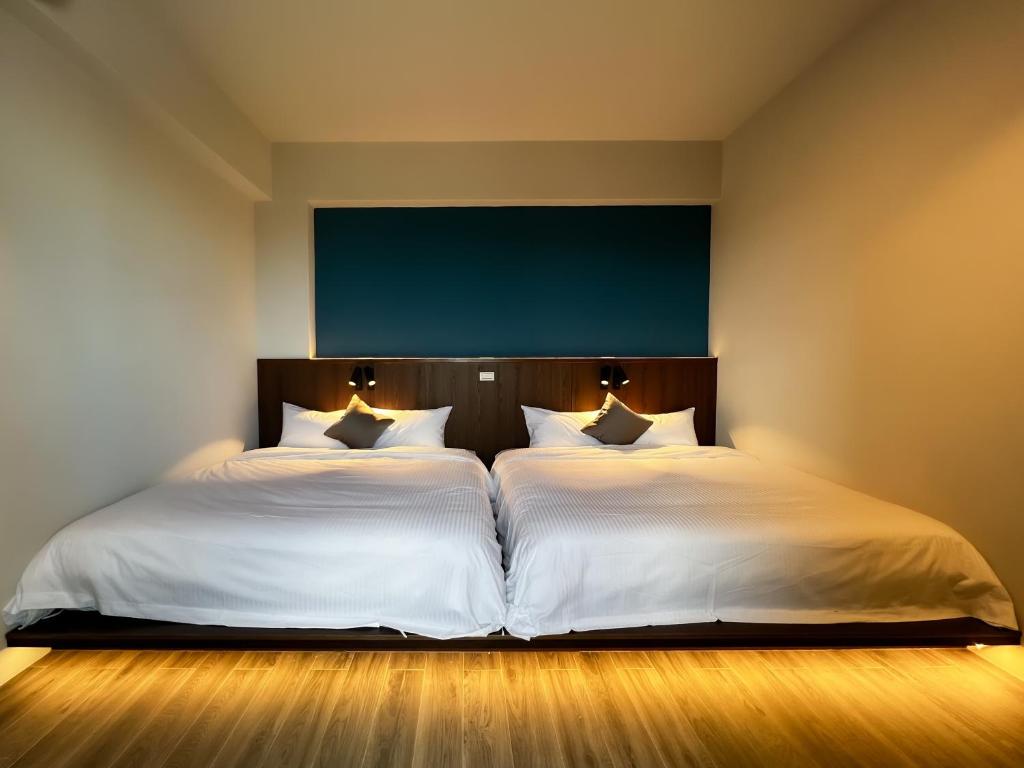 Postel nebo postele na pokoji v ubytování 漁聲民宿 FishON B&B