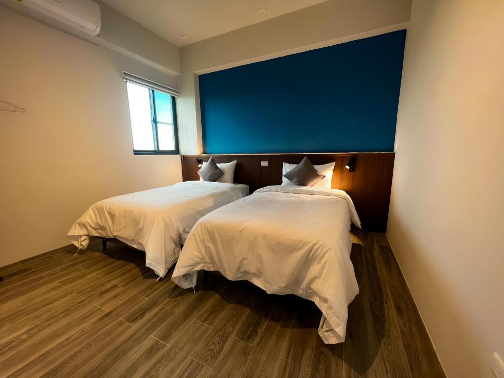 Postel nebo postele na pokoji v ubytování 漁聲民宿 FishON B&B