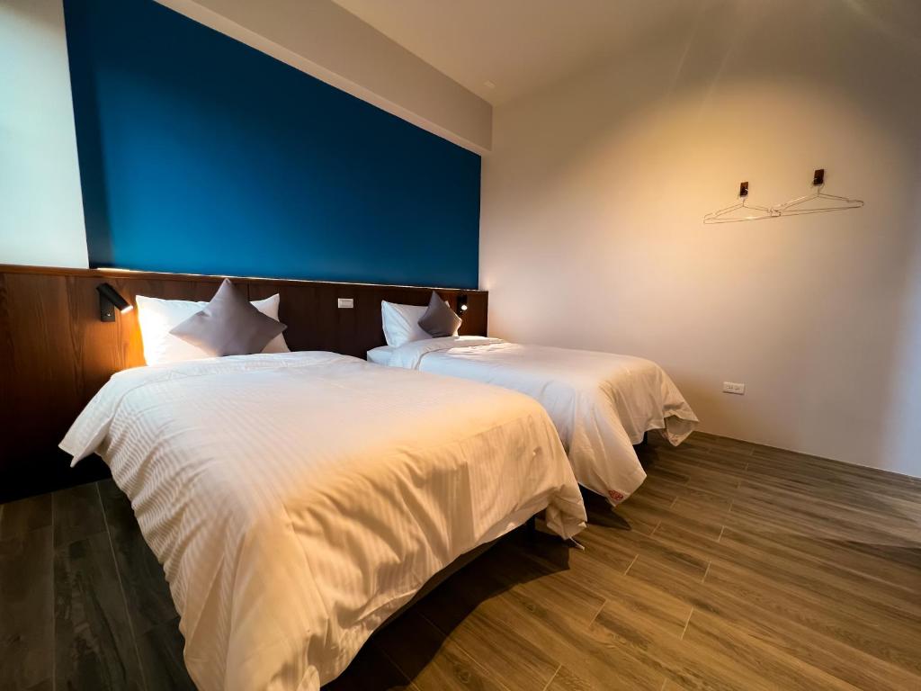 Postel nebo postele na pokoji v ubytování 漁聲民宿 FishON B&B