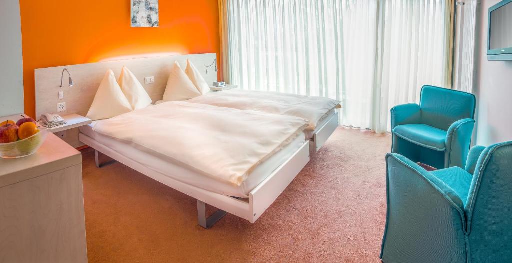 Postel nebo postele na pokoji v ubytování Hotel Unione