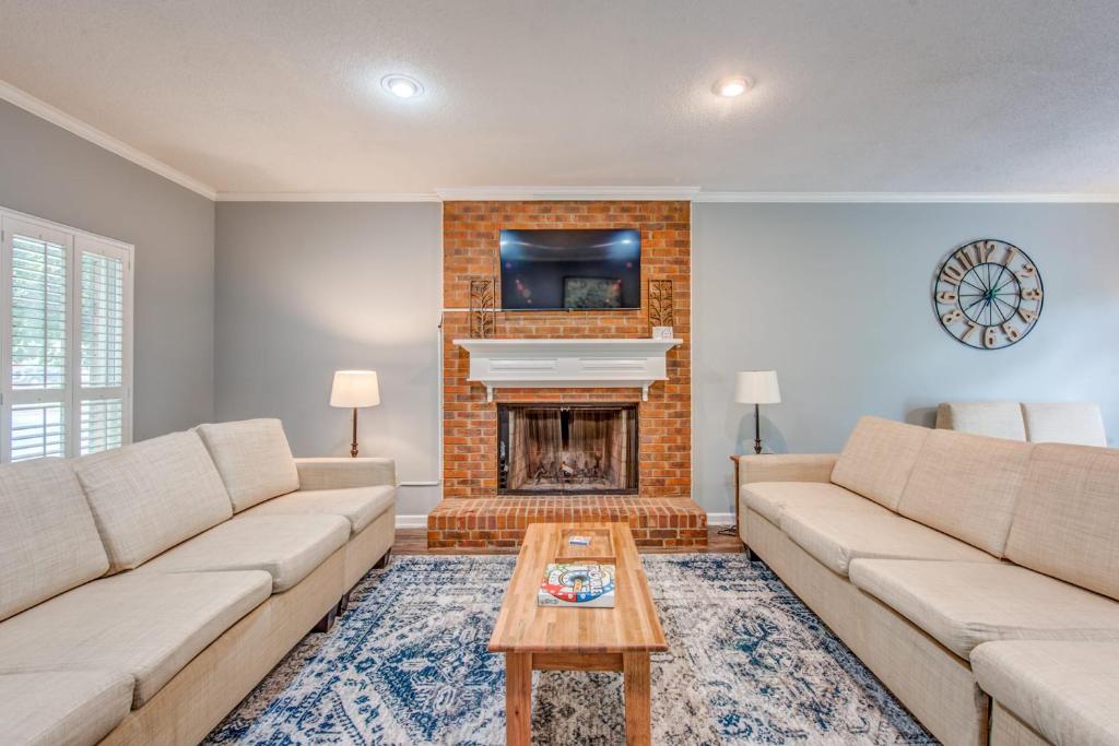 a living room with two couches and a fireplace at Cozy in Cordova-- Close to I-40 in Memphis