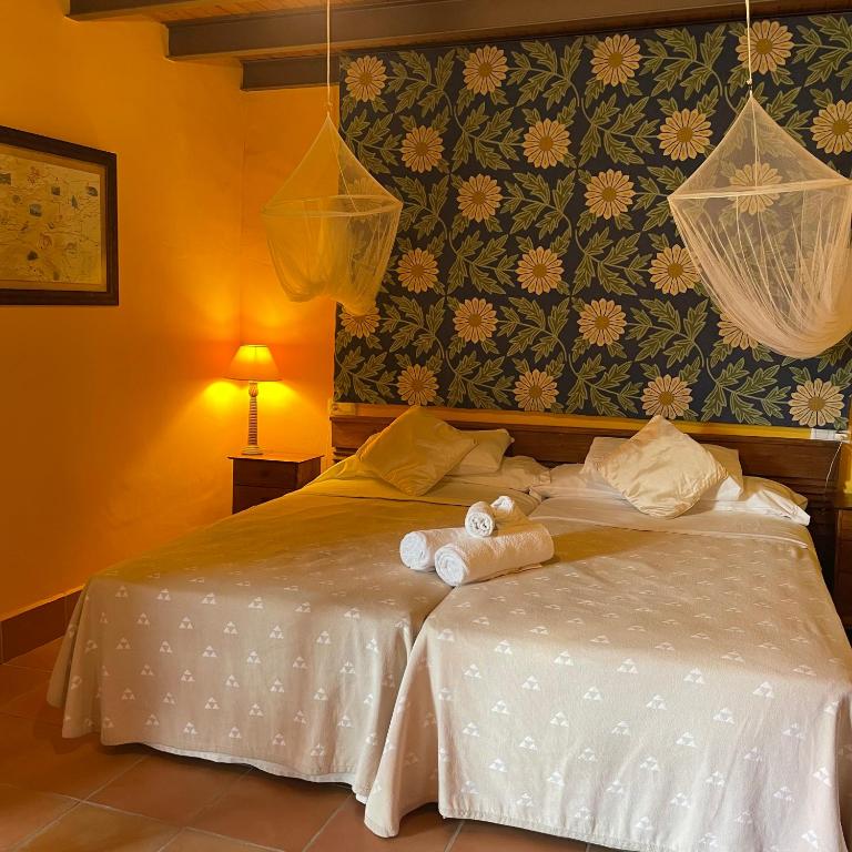 Postel nebo postele na pokoji v ubytování Casa Gallinera
